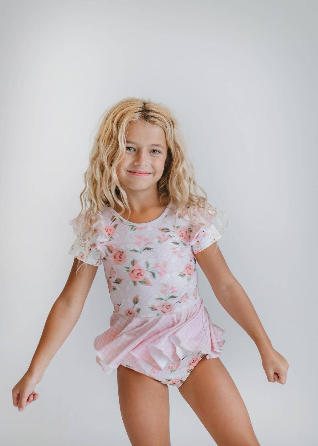 Maillot de gimnasia con falda y volantes para niños en color rosa pálido