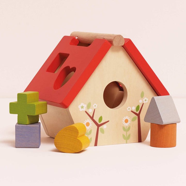 Clasificador de formas de casas para pájaros del bosque