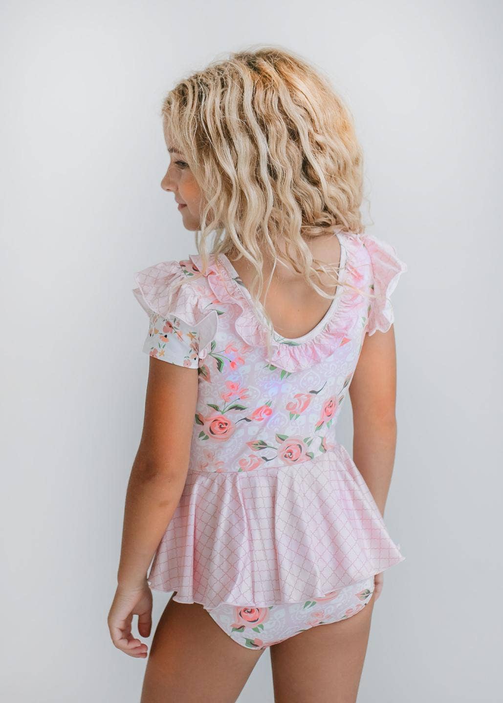 Maillot de gimnasia con falda y volantes para niños en color rosa pálido
