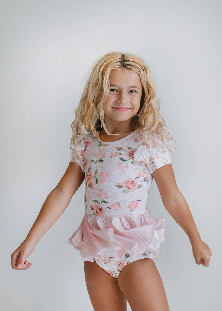Maillot de gimnasia con falda y volantes para niños en color rosa pálido