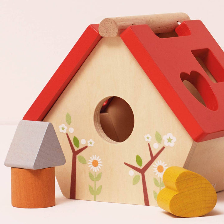 Clasificador de formas de casas para pájaros del bosque